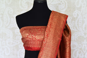 Up your stylish appeal in this royal blue matka banarsi silk saree with a graceful red zari border. Style this saree with a stunning bright red zari designer blouse complemented with a heavily woven pallu. Shop handloom sarees, linen sari, chiffon saree online or visit Pure Elegance store, USA.-blouse pallu