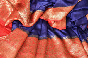 Up your stylish appeal in this royal blue matka banarsi silk saree with a graceful red zari border. Style this saree with a stunning bright red zari designer blouse complemented with a heavily woven pallu. Shop handloom sarees, linen sari, chiffon saree online or visit Pure Elegance store, USA.-details