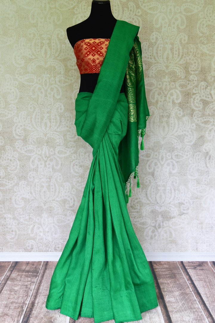 Satiate your saree appetite in this green muga silk drapery with a gorgeous silver zari work designed on the pallu. Style this piece with a statement red zari designer blouse to add a pop of color. Shop handcrafted silk saris, linen saree, chiffon saree online or visit Pure Elegance store, USA.-full view