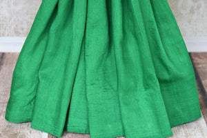 Satiate your saree appetite in this green muga silk drapery with a gorgeous silver zari work designed on the pallu. Style this piece with a statement red zari designer blouse to add a pop of color. Shop handcrafted silk saris, linen saree, chiffon saree online or visit Pure Elegance store, USA.-pleats