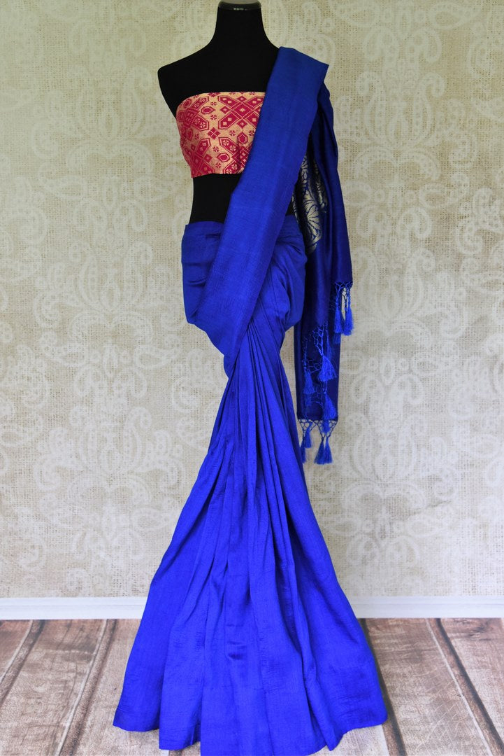 Enchant the folks in this royal blue muga silk saree. It comes with gorgeous silver zari detailing on the pallu. Style this stunning sari with a contrasting red zari designer blouse. Shop handcrafted silk sarees, linen sari, georgette sari online or visit Pure Elegance store, USA.-full view