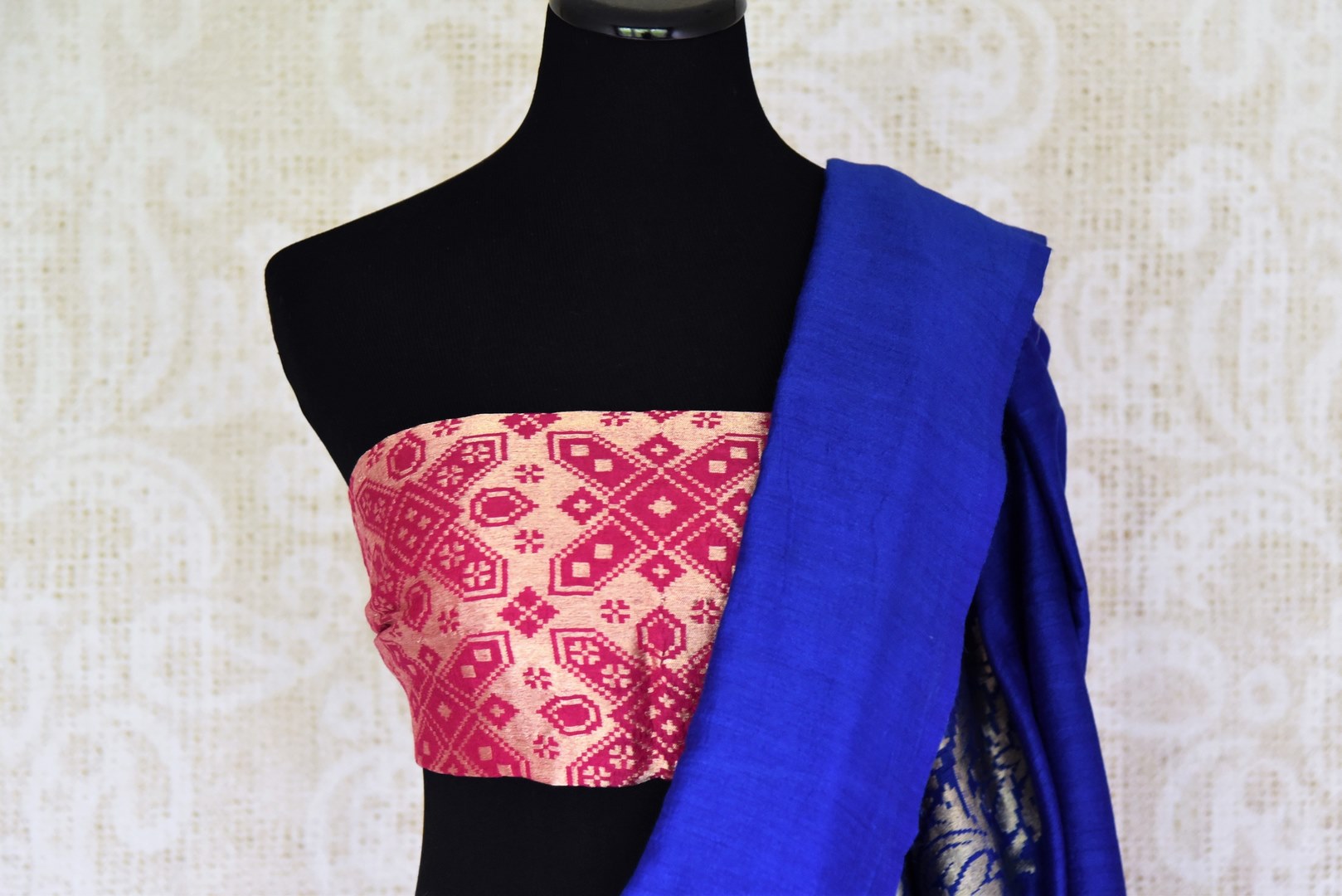 Enchant the folks in this royal blue muga silk saree. It comes with gorgeous silver zari detailing on the pallu. Style this stunning sari with a contrasting red zari designer blouse. Shop handcrafted silk sarees, linen sari, georgette sari online or visit Pure Elegance store, USA.-blouse pallu