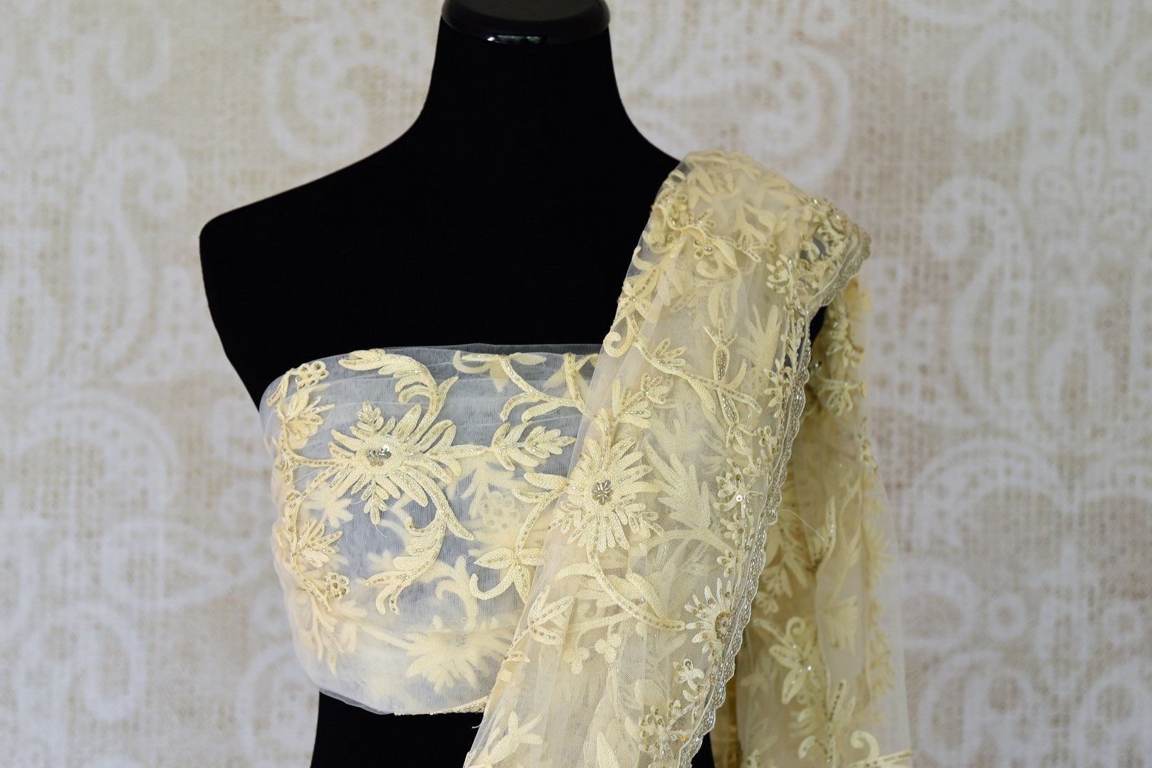 Buy off-white embroidered net saree online in USA. Adorn your style with a range of exquisite sarees with blouses from Pure Elegance Indian clothing store in USA. We have an exquisite range of Indian designer sarees, silk sarees, Banarasi saris and many other varieties also available at our online store.-blouse pallu