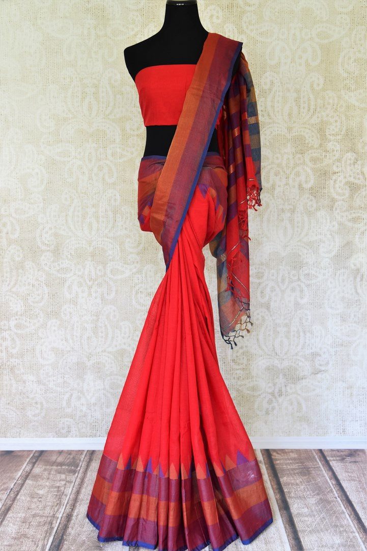 Shop red linen saree online in USA with purple border from Pure Elegance online store. Visit our exclusive Indian clothing store in USA and get floored by a range of exquisite Indian sarees, handloom sarees, silk sarees, Indian jewelry and much more to complete your ethnic look.-full view