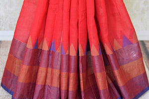 Shop red linen saree online in USA with purple border from Pure Elegance online store. Visit our exclusive Indian clothing store in USA and get floored by a range of exquisite Indian sarees, handloom sarees, silk sarees, Indian jewelry and much more to complete your ethnic look.-pleats
