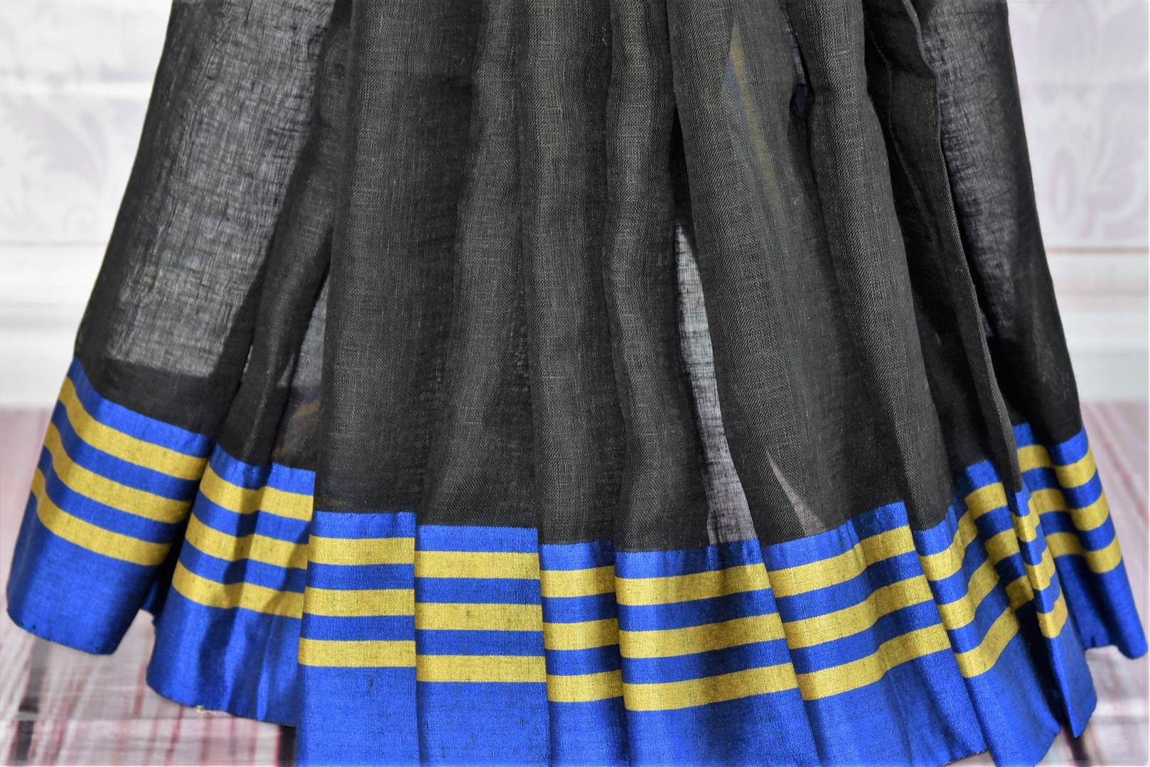 Buy black and grey linen saree with Banarasi blouse online in USA. Find an exquisite range of pure handloom sarees in USA at Pure Elegance Indian clothing store. Enhance your ethnic look with a variety of silk sarees, Banarasi saris, Kanchipuram, and Indian jewelry available at our online store.-pleats