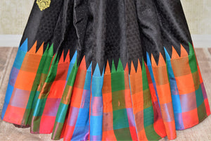 Buy black Kanjeevaram silk saree with multicolor check border and zari buta online in USA from Pure Elegance online store. Visit our exclusive Indian clothing store in USA and get floored by a range of exquisite Indian Kanjivaram saris, handloom sarees, silk sarees, Indian jewelry and much more to complete your ethnic look.-pleats