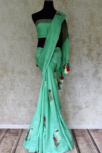 Buy pastel green muga Banarasi sari online in USA with floral buta from Pure Elegance online store. Visit our exclusive Indian clothing store in USA and get floored by a range of exquisite Indian Kanjivaram saris, Banarasi sarees, silk sarees, Indian jewelry and much more to complete your ethnic look.-full view