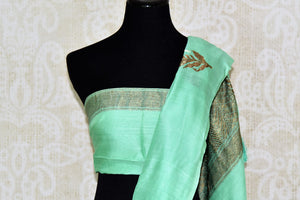 Buy pastel green muga Banarasi sari online in USA with floral buta from Pure Elegance online store. Visit our exclusive Indian clothing store in USA and get floored by a range of exquisite Indian Kanjivaram saris, Banarasi sarees, silk sarees, Indian jewelry and much more to complete your ethnic look.-blouse pallu