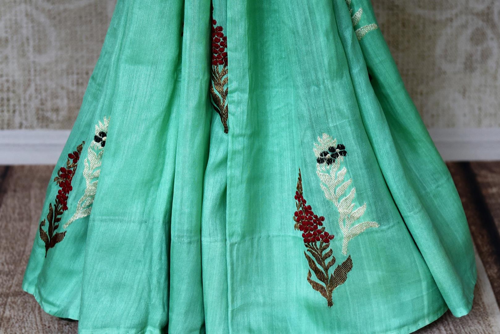 Buy pastel green muga Banarasi sari online in USA with floral buta from Pure Elegance online store. Visit our exclusive Indian clothing store in USA and get floored by a range of exquisite Indian Kanjivaram saris, Banarasi sarees, silk sarees, Indian jewelry and much more to complete your ethnic look.-pleatx