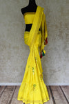 Shop bright yellow muga Banarasi saree online in USA with floral buta from Pure Elegance online store. Visit our exclusive Indian clothing store in USA and get floored by a range of exquisite Indian Kanjivaram saris, Banarasi sarees, silk sarees, Indian jewelry and much more to complete your ethnic look.-full view