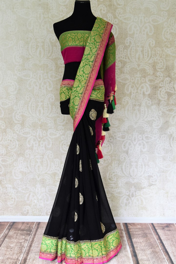 Shop black georgette Benarasi sari online in USA with green pink floral zari border from Pure Elegance online store. Visit our exclusive Indian clothing store in USA and get floored by a range of exquisite pure handloom sarees, Banarasi sarees, silk sarees, Indian jewelry and much more to complete your ethnic look.-full view