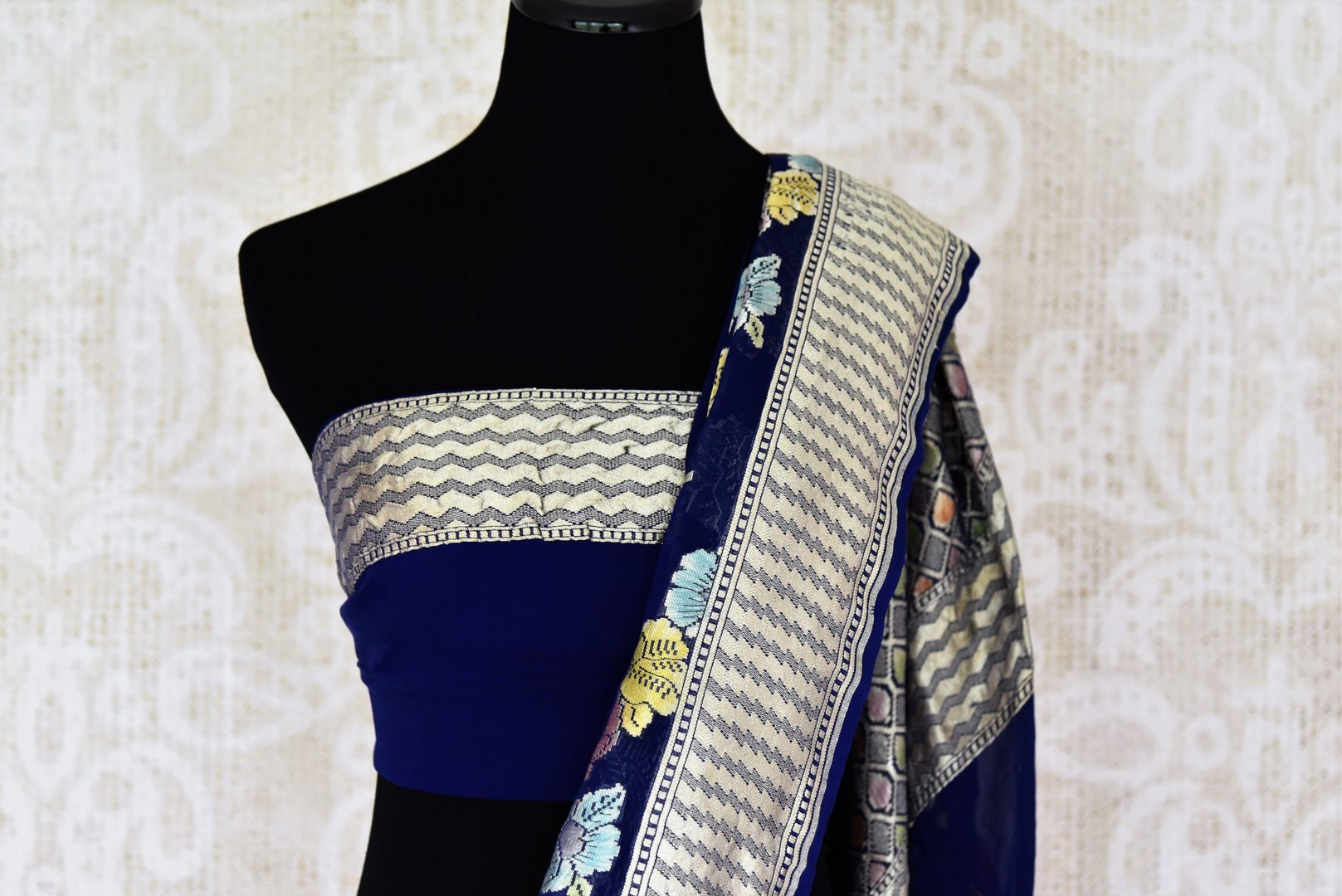 Buy dark blue georgette Benarasi saree online in USA with overall floral zari jaal from Pure Elegance online store. Visit our exclusive Indian clothing store in USA and get floored by a range of exquisite pure handloom sarees, Banarasi sarees, silk sarees, Indian jewelry and much more to complete your ethnic look.-blouse pallu