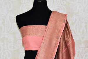 Shop pink color muga Banarasi sari online in USA with floral zari and minakari work from Pure Elegance online store. Visit our exclusive Indian clothing store in USA and get floored by a range of exquisite pure handloom sarees, Banarasi sarees, silk sarees, Indian jewelry and much more to complete your ethnic look.-blouse pallu