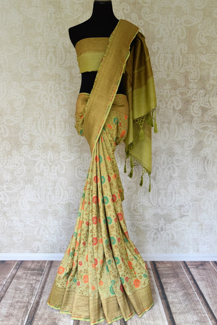 Shop green color muga Banarasi saree online in USA with floral zari and minakari work from Pure Elegance online store. Visit our exclusive Indian clothing store in USA and get floored by a range of exquisite pure handloom sarees, Banarasi sarees, silk sarees, Indian jewelry and much more to complete your ethnic look.-full view
