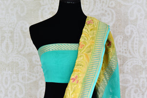 Shop yellow Banarasi georgette saree online in USA with floral zari border from Pure Elegance online store. Visit our exclusive Indian fashion store in USA and get floored by a range of exquisite pure handloom sarees, Banarasi sarees, silk sarees, Indian jewelry and much more to complete your ethnic look.-blouse pallu
