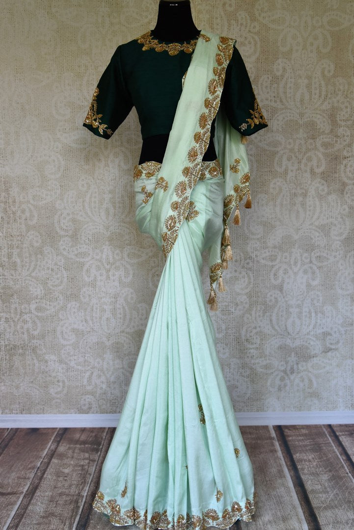 Buy pastel green hand embroidered sari with embroidered saree blouse online in USA from Pure Elegance. Be an epitome of Indian fashion on special occasions with beautiful designer sarees, Banarasi sarees available at our Indian fashion store in USA. -full view