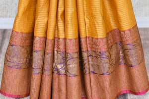 Shop beautiful mustard color tussar Benarasi saree online in USA with antique zari border. Be the talk of every occasion in beautiful Indian designer saris, pure silk sarees, Banarasi sarees from Pure Elegance clothing fashion store in USA this wedding season.-pleats