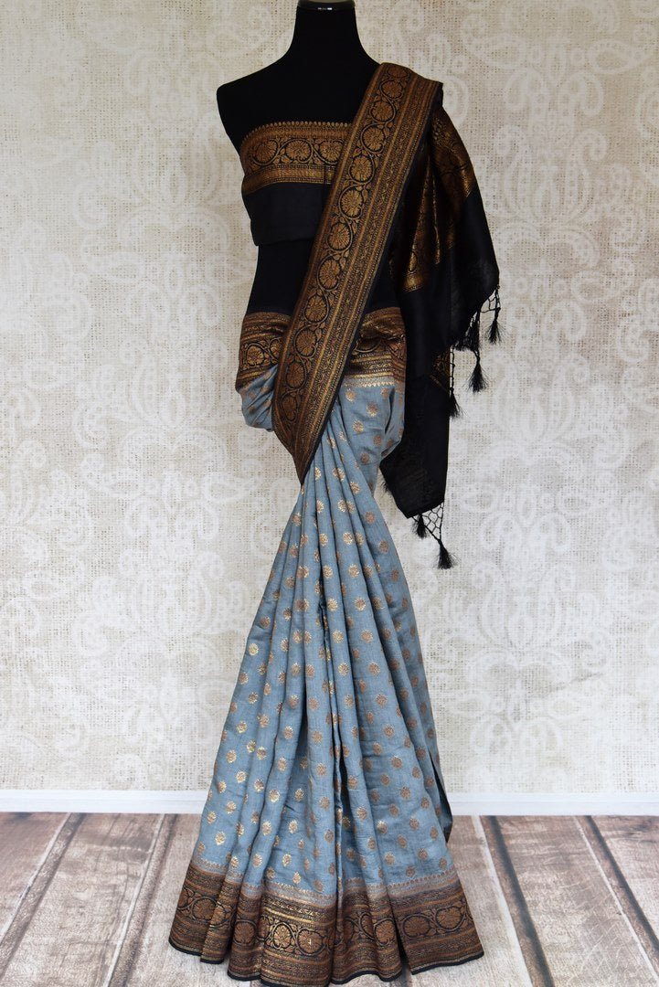 Shop grey muga tussar saree online in USA with zari buta and black zari border from Pure Elegance. Choose from a range of exquisite Indian designer saris, Banarasi sarees, pure silk sarees in beautiful styles and designs from our Indian fashion store in USA and flaunt your tasteful sartorial choices on special occasions.-full view