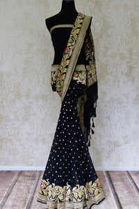 Buy black georgette Benarasi sari online in USA with floral zari border. Find a splendid collection of Indian designer sarees with blouses in USA at Pure Elegance Indian clothing store. Make a striking appearance on festive occasions by shopping from a range of pure silk saris, Banarasi sarees, embroidered saris from our online store.-full view