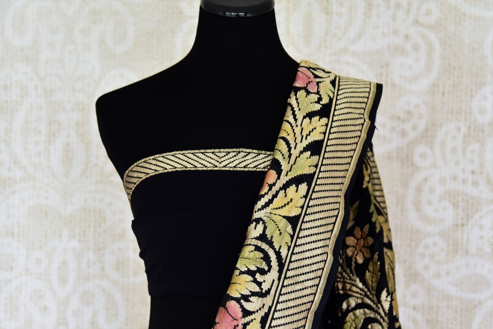 Buy black georgette Benarasi sari online in USA with floral zari border. Find a splendid collection of Indian designer sarees with blouses in USA at Pure Elegance Indian clothing store. Make a striking appearance on festive occasions by shopping from a range of pure silk saris, Banarasi sarees, embroidered saris from our online store.-blouse pallu