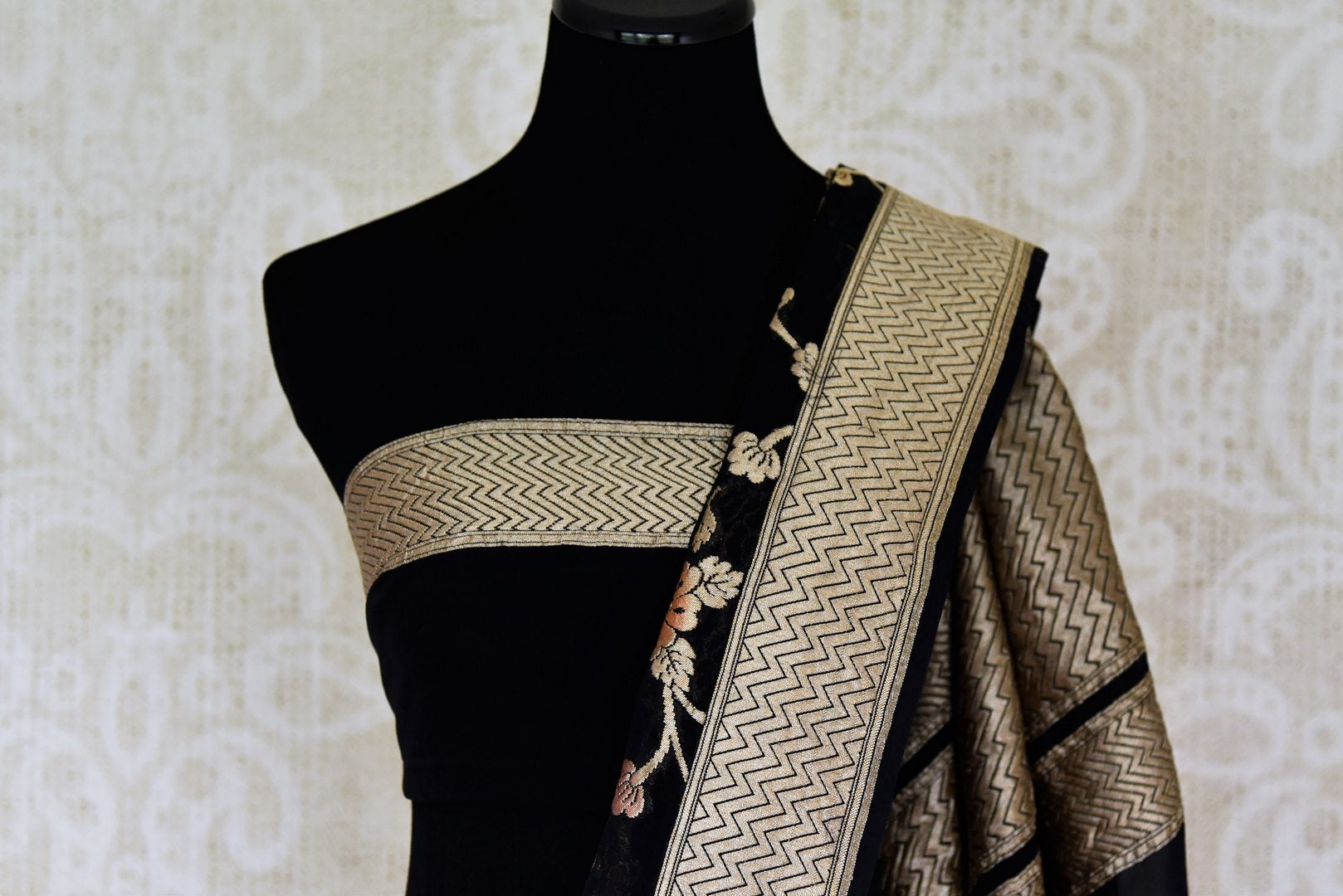 Buy black Banarasi georgette sari online in USA with floral zari work. Find a splendid collection of Indian designer sarees with blouses in USA at Pure Elegance Indian clothing store. Make a striking appearance on festive occasions by shopping from a range of pure silk saris, Banarasi sarees, embroidered saris from our online store.-blouse pallu