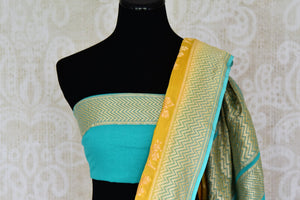 Buy yellow Banarasi georgette saree online in USA with blue zari border. Find a splendid collection of Indian designer sarees with blouses in USA at Pure Elegance Indian clothing store. Make a striking appearance on festive occasions by shopping from a range of pure silk saris, Banarasi sarees, embroidered saris from our online store.-blouse pallu