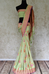 Buy pista green Banarasi georgette sari online in USA with floral zari motifs. Find a splendid collection of Indian designer sarees with blouses in USA at Pure Elegance Indian clothing store. Make a striking appearance on festive occasions by shopping from a range of pure silk saris, Banarasi sarees, embroidered saris from our online store.-full view