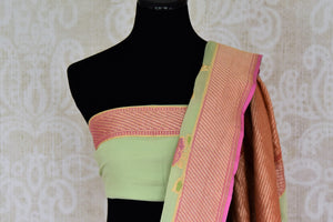 Buy pista green Banarasi georgette sari online in USA with floral zari motifs. Find a splendid collection of Indian designer sarees with blouses in USA at Pure Elegance Indian clothing store. Make a striking appearance on festive occasions by shopping from a range of pure silk saris, Banarasi sarees, embroidered saris from our online store.-blouse pallu