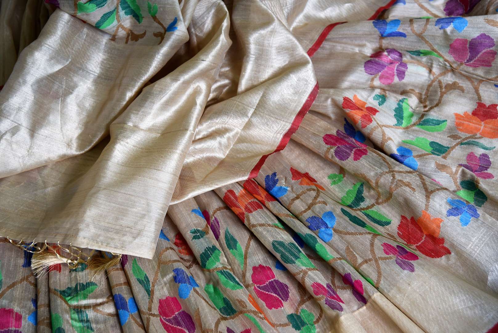 Shop beige tussar Benarasi saree online in USA with bright floral border. Find a splendid collection of Indian handloom saris with in USA at Pure Elegance Indian clothing store. Drape yourself in beautiful pure silk saris, Banarasi sarees, embroidered saris on festive occasions from our online store.-details