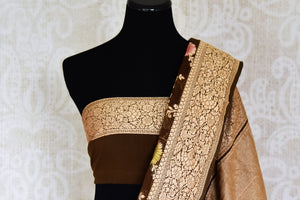Buy brown color Benarasi georgette sari online in USA with minakari zari floral creeper design. Shine bright on special occasions with traditional Indian sarees, Banarasi sarees, pure silk sarees in rich colors and designs from Pure Elegance Indian fashion store in USA.-blouse pallu