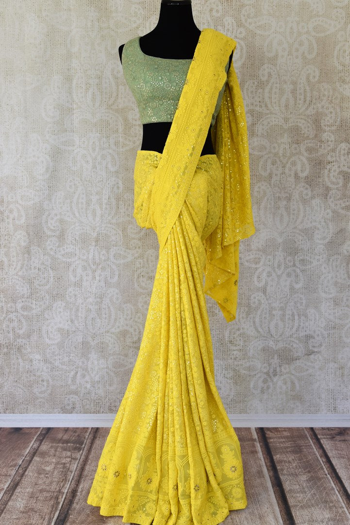 Buy yellow georgette Lucknowi saree online in USA from Pure Elegance. Be an epitome of Indian fashion on special occasions with beautiful designer sarees with blouses, Banarasi sarees, Kanchipuram silk saris available at our Indian fashion store in USA. -full view