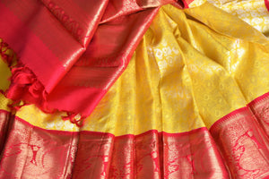 Buy yellow Kanchipuram silk sari with red zari border online in USA from Pure Elegance. Make your ethnic style perfect with a range of exquisite Indian designer saris with blouses, embroidered sarees, pure handloom sarees available at our exclusive Indian fashion store in USA and also on our online store. Shop now.-details