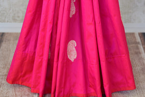 Shop bright pink Banarasi silk sari online in USA with paisley zari buta from Pure Elegance. Add exquisite traditional Banarasi saris, wedding sarees, pure silk sarees in beautiful designs to your ethnic wardrobe from our Indian clothing store in USA or shop online.-pleats
