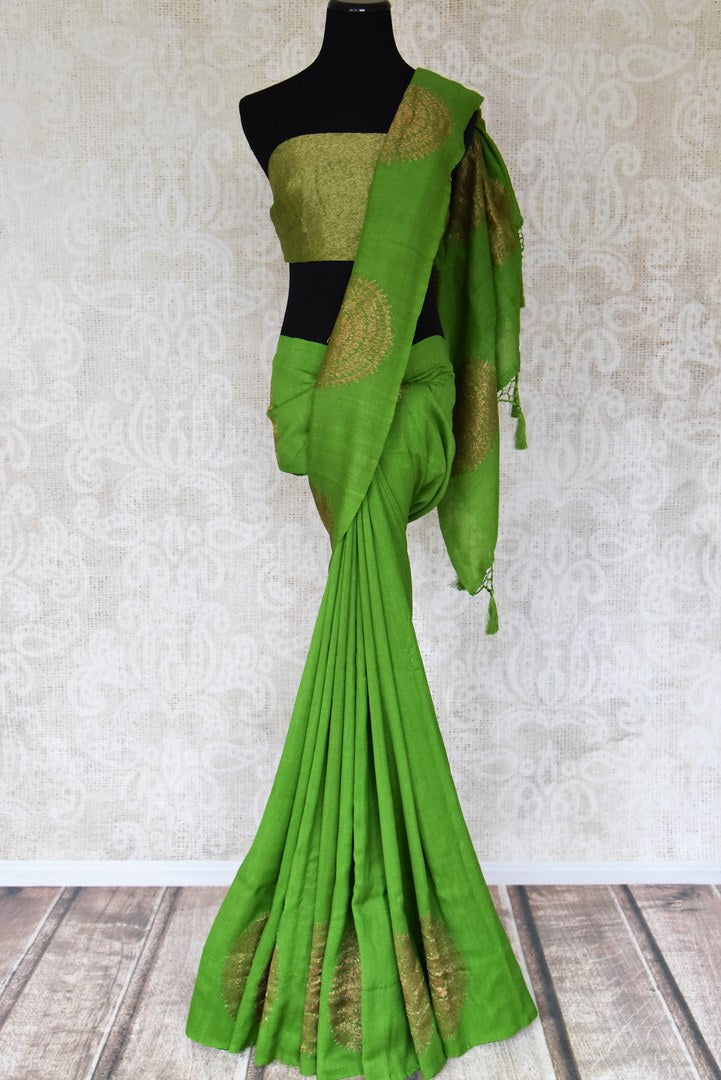 Buy beautiful green muga silk saree online in USA with big floral chakra zari buta. Dazzle on special occasions in ethnic wear from Pure Elegance. Explore a range of exquisite Indian designer sarees, pure silk saris, handwoven sarees at our exclusive Indian fashion store in USA.-full view