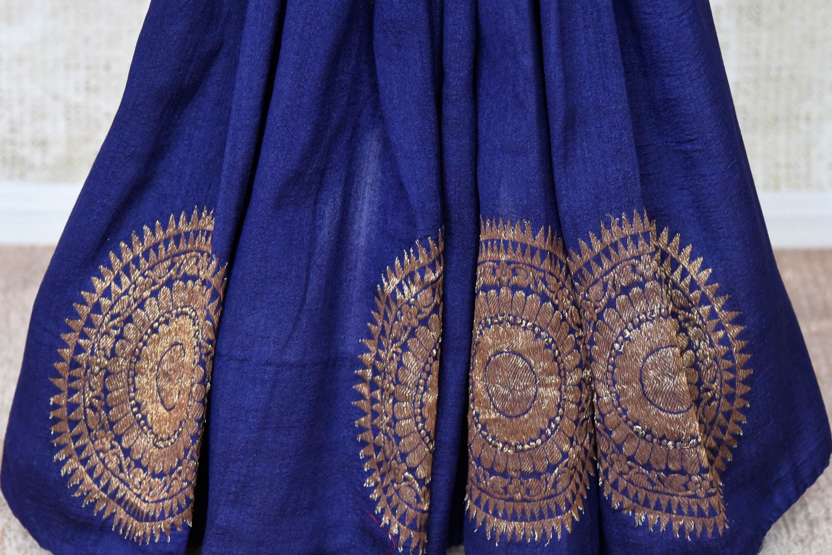 Shop navy blue muga silk saree online in USA with big chakra zari buta. Elevate your traditional style with exquisite Indian handloom sarees from Pure Elegance Indian clothing store in USA. Explore a range of stunning pure silk saris, embroidered sarees, wedding sarees especially from India for women in USA.-pleats