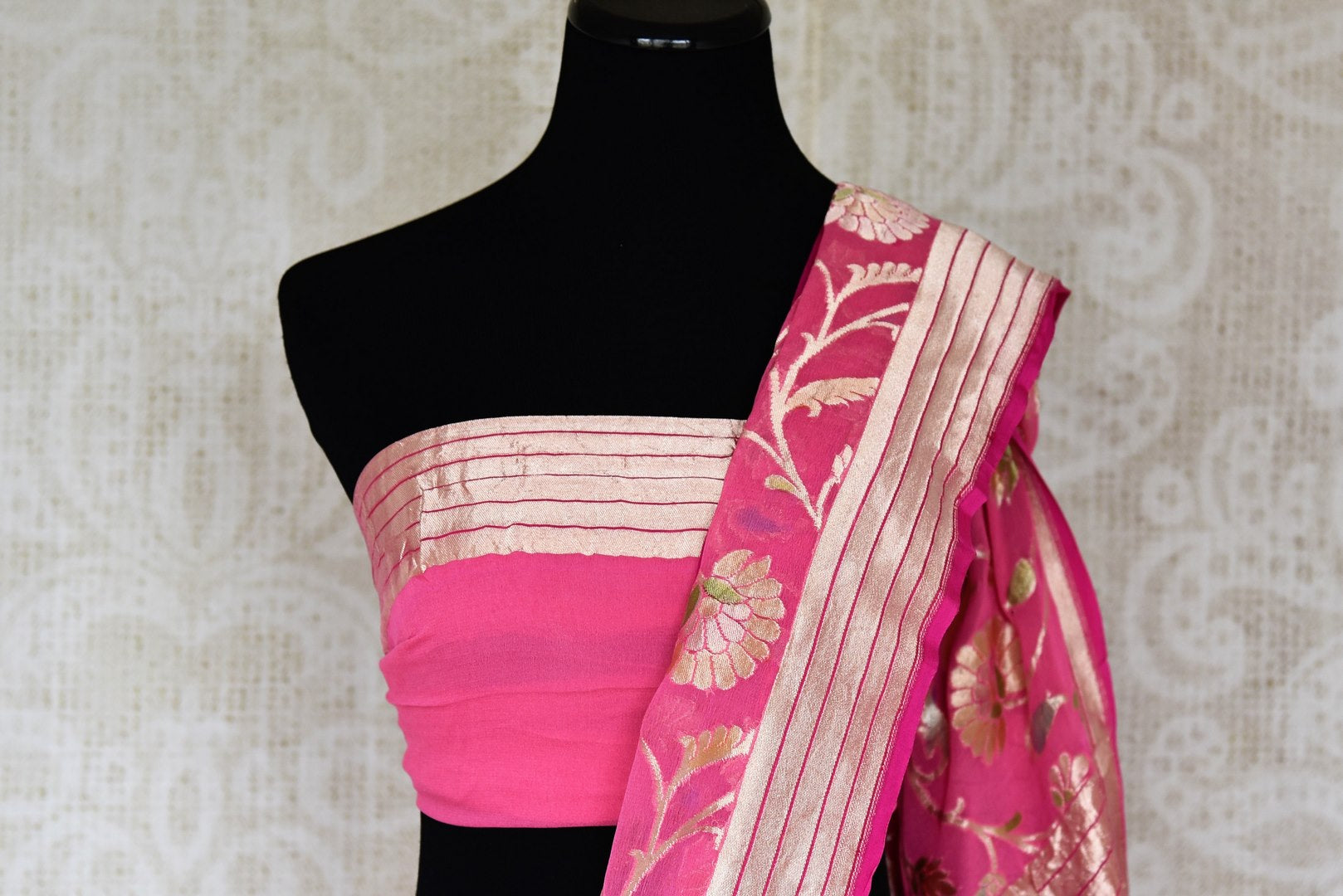 Shop pink georgette Banarasi sari online in USA with overall floral zari design. Elevate your traditional saree style with beautiful Indian Banarasi saris from Pure Elegance Indian fashion store in USA. We also have a stunning variety of bridal sarees for Indian brides in USA. Shop now.-blouse pallu