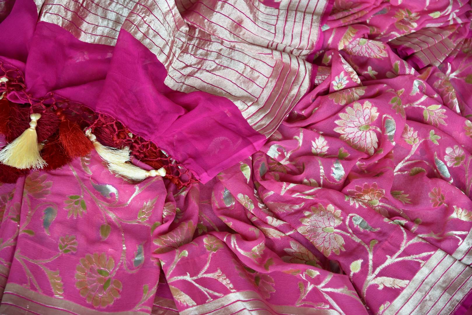 Shop pink georgette Banarasi sari online in USA with overall floral zari design. Elevate your traditional saree style with beautiful Indian Banarasi saris from Pure Elegance Indian fashion store in USA. We also have a stunning variety of bridal sarees for Indian brides in USA. Shop now.-details