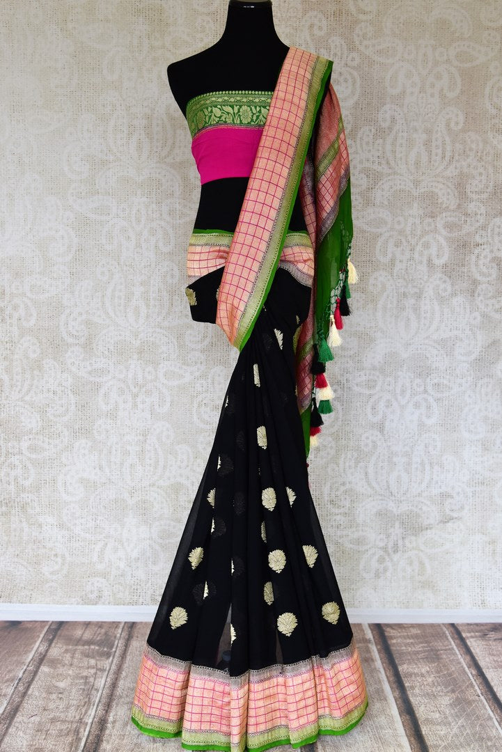 Buy stunning black georgette Banarasi sari online in USA with floral zari buta and check zari border. Elevate your traditional saree style with beautiful Indian Banarasi saris from Pure Elegance Indian fashion store in USA. We also have a stunning variety of bridal saris for Indian brides in USA. Shop now.-full view