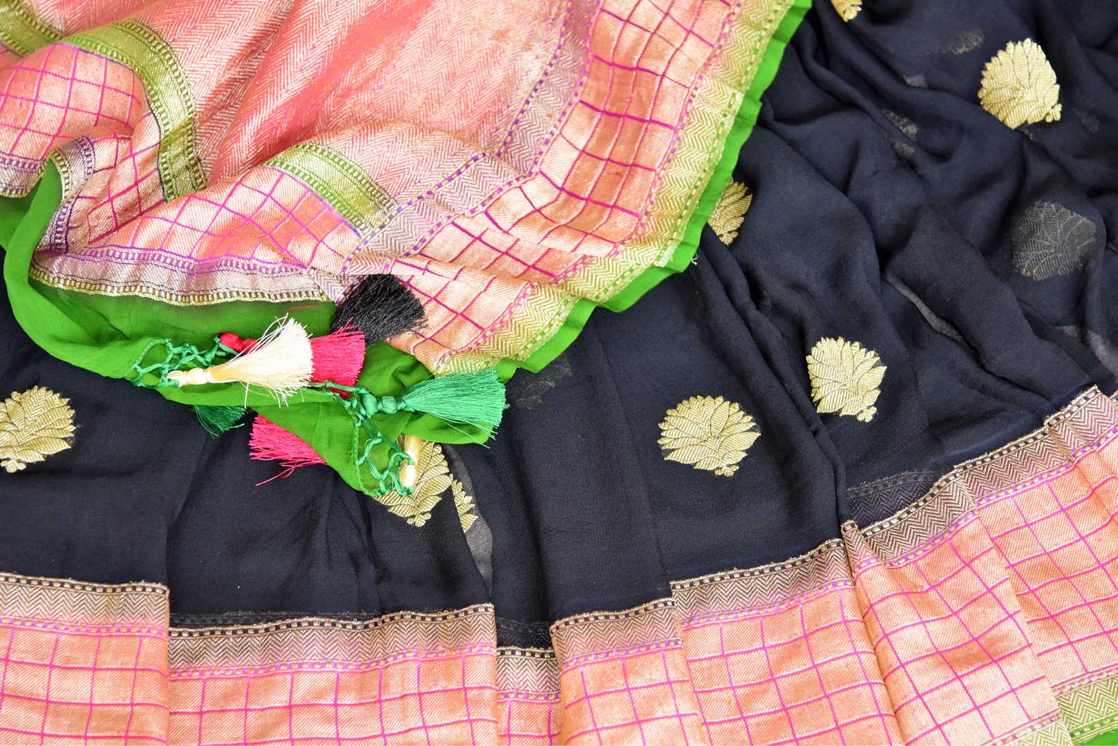 Buy stunning black georgette Banarasi sari online in USA with floral zari buta and check zari border. Elevate your traditional saree style with beautiful Indian Banarasi saris from Pure Elegance Indian fashion store in USA. We also have a stunning variety of bridal saris for Indian brides in USA. Shop now.-details