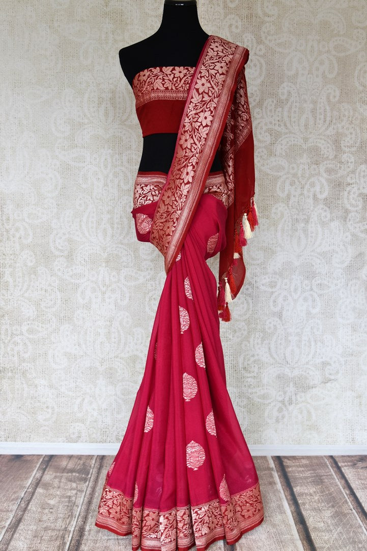 Buy pink georgette Banarasi saree online in USA with floral zari buta and red foliate zari border. Elevate your traditional saree style with beautiful Indian Banarasi saris from Pure Elegance Indian fashion store in USA. We also have a stunning variety of bridal saris for Indian brides in USA. Shop now.-full view