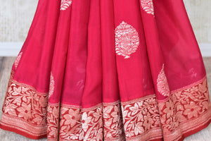 Buy pink georgette Banarasi saree online in USA with floral zari buta and red foliate zari border. Elevate your traditional saree style with beautiful Indian Banarasi saris from Pure Elegance Indian fashion store in USA. We also have a stunning variety of bridal saris for Indian brides in USA. Shop now.-pleats