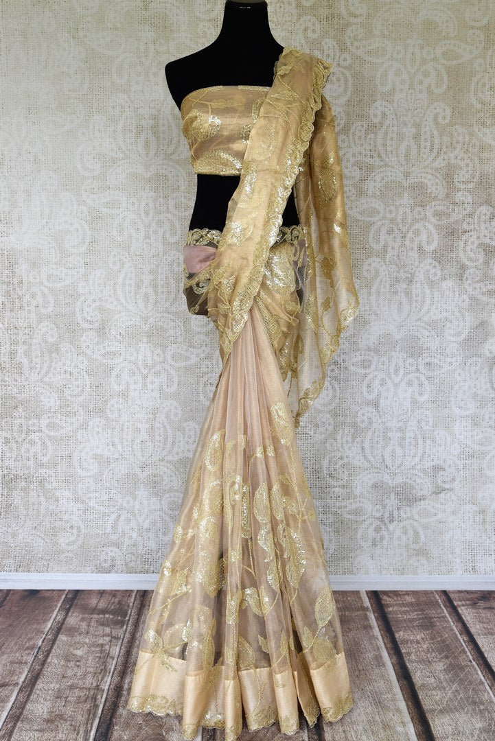 Shop beige zari tissue saree online in USA with sequin work. Relive tradition in Indian designer sarees from Pure Elegance Indian fashion store in USA. Enhance your style with pure silk sarees, Kanchipuram sarees, handloom sarees available online.-full view