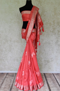 Shop coral color tussar Banarasi saree online in USA with floral zari buta and zari border. Be an epitome of elegance in exquisite Banarasi sarees from Pure Elegance Indian clothing store in USA.-full view