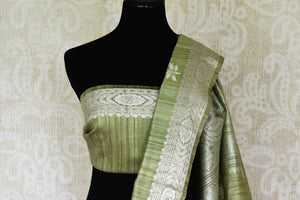 Buy pista green tussar Banarasi saree online in USA with floral zari buta and zari border. Be an epitome of elegance in exquisite Banarasi sarees from Pure Elegance Indian clothing store in USA.-blouse pallu