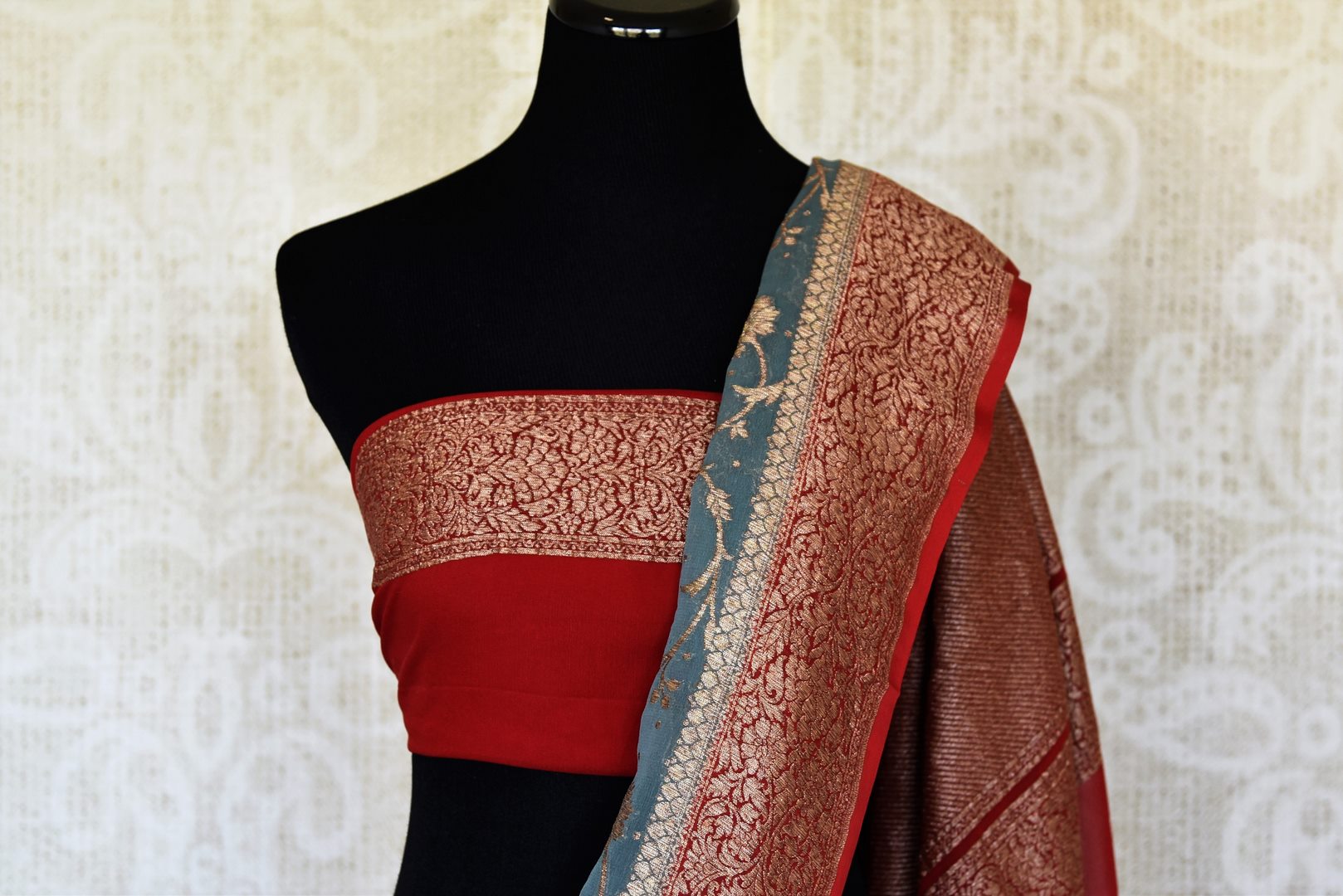 Buy blue georgette Banarasi sari online in USA with red zari border. Feel traditional on special occasions in beautiful Indian designer saris from Pure Elegance Indian fashion store in USA. Choose from a splendid variety of Banarasi sarees, pure handwoven saris. Buy online.-blouse pallu