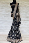 Shop black georgette Banarasi saree online in USA with silver zari buta and zari border. Make your ethnic wardrobe colorful and rich with a splendid collection of Banarasi sarees from Pure Elegance Indian clothing store in USA. Shop online.-full view