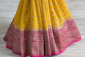 Buy yellow Banarasi sari online in USA with pink antique zari border. Elevate your traditional glam on weddings and special occasions with an exclusive range of handwoven sarees, designer sarees especially for Indian women in USA at Pure Elegance Indian fashion store. Shop now.-pleats