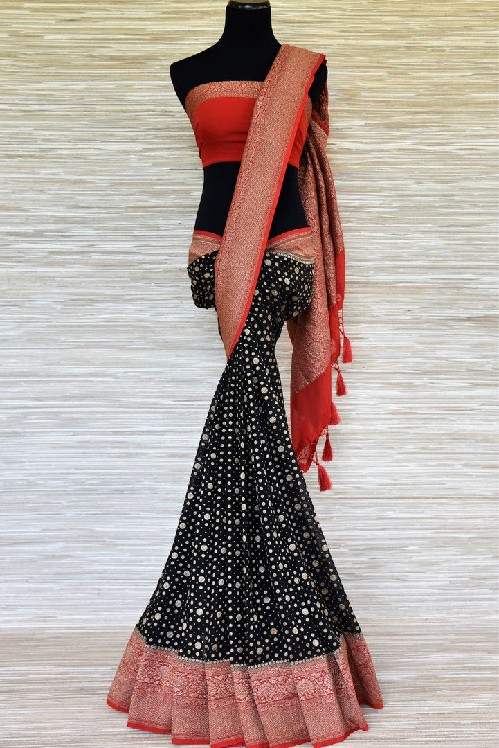 Shop black georgette Banarasi sari online in USA with red zari border. Make your ethnic wardrobe colorful and rich with a splendid collection of Banarasi sarees from Pure Elegance Indian clothing store in USA. Shop online.-full view