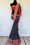 Buy ink blue georgette Banarasi sari online in USA with red antique zari border. Feel traditional on special occasions in beautiful Indian designer saris from Pure Elegance Indian fashion store in USA. Choose from a splendid variety of Banarasi sarees, pure handwoven saris. Buy online.-full view